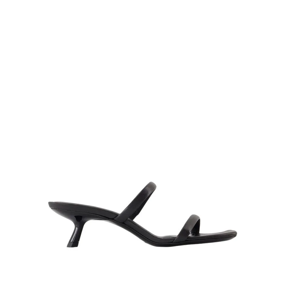 Sleek Black Calfskin Mules With Curved Heel